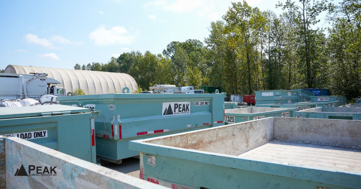 Multiple construction disposal bins organized for LEED-oriented waste diversion, coordinated hauling, material separation, and sustainability compliance support.