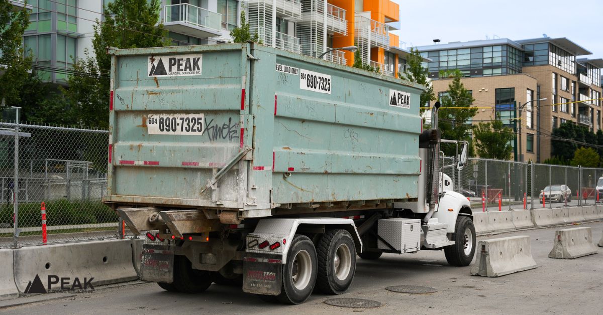 Peak Disposal construction waste truck supporting commercial hauling logistics and coordinated waste removal operations in Metro Vancouver.