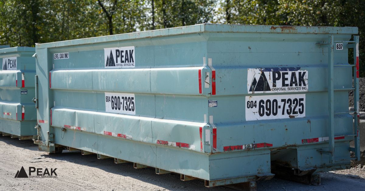 Large construction waste disposal dumpster illustrating organized LEED waste diversion, landfill reduction, and documented material management practices.