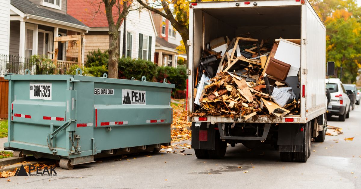 Side-by-side comparison of green dumpster rental and loaded junk removal truck, illustrating key differences for waste disposal projects