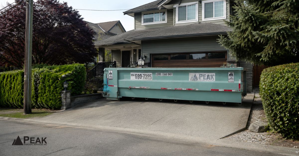 30-yard dumpster positioned on a residential driveway, illustrating space requirements, access considerations, overhead clearance, and placement feasibility.